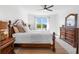 Main bedroom with king-size bed and ensuite bathroom at 43104 Lakeside Way, Punta Gorda, FL 33982