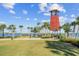 Relaxing community park with a clock tower and palm trees at 43104 Lakeside Way, Punta Gorda, FL 33982
