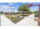 Park entrance with walking paths, benches, and a basketball court at 43104 Lakeside Way, Punta Gorda, FL 33982