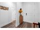 Modern entryway with hardwood floors and a shoe cabinet at 43104 Lakeside Way, Punta Gorda, FL 33982