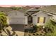 White two-story house with a two-car garage and landscaped yard at 43104 Lakeside Way, Punta Gorda, FL 33982