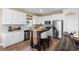 Modern kitchen with white cabinets, stainless steel appliances, and kitchen island at 43104 Lakeside Way, Punta Gorda, FL 33982