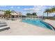 Community swimming pool with lounge chairs and a large sundeck at 43104 Lakeside Way, Punta Gorda, FL 33982