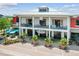 Two-story restaurant with outdoor seating and modern design at 43104 Lakeside Way, Punta Gorda, FL 33982