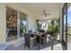 Spacious screened porch with outdoor furniture and view of backyard at 43104 Lakeside Way, Punta Gorda, FL 33982