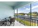 Enjoy the lake view from this screened balcony with a table and seating at 5738 Sabal Trace Dr # 204B57, North Port, FL 34287