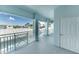 Exterior balcony view on a sunny day showing palm trees and a white door at 5738 Sabal Trace Dr # 204B57, North Port, FL 34287