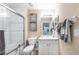 Bathroom features a shower over tub with a modern vanity and great lighting at 5738 Sabal Trace Dr # 204B57, North Port, FL 34287