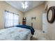 Well-lit bedroom with vaulted ceilings, a comfortable bed, and a mounted tv bracket at 5738 Sabal Trace Dr # 204B57, North Port, FL 34287