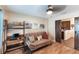 Cozy bedroom featuring a comfortable couch, desk, and stylish decor at 5738 Sabal Trace Dr # 204B57, North Port, FL 34287