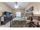 Bedroom featuring a bed, dresser, TV and natural light from a window at 5738 Sabal Trace Dr # 204B57, North Port, FL 34287