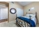 Inviting bedroom with neutral walls, carpet, and a comfortable bed; view to bathroom and closet at 5738 Sabal Trace Dr # 204B57, North Port, FL 34287