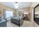 Cozy bedroom with a metal bed frame, carpet floors, and neutral walls at 5738 Sabal Trace Dr # 204B57, North Port, FL 34287