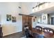 Dining area showcasing wood flooring, sliding barn doors, and a lovely view of the living and kitchen areas at 5738 Sabal Trace Dr # 204B57, North Port, FL 34287