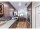 Modern kitchen features granite countertops, stainless steel appliances, and open layout at 5738 Sabal Trace Dr # 204B57, North Port, FL 34287