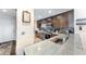 Modern kitchen features granite countertops, stainless steel appliances, and dark wood cabinetry at 5738 Sabal Trace Dr # 204B57, North Port, FL 34287