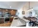 Modern kitchen with stainless steel appliances, granite counters, and an open layout with a breakfast bar at 5738 Sabal Trace Dr # 204B57, North Port, FL 34287