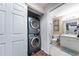 Efficient laundry setup with a stacked washer/dryer unit adjacent to the bathroom at 5738 Sabal Trace Dr # 204B57, North Port, FL 34287