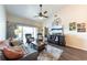 Inviting living room with high ceilings, comfortable seating, and access to the lanai at 5738 Sabal Trace Dr # 204B57, North Port, FL 34287