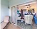 Open concept living and dining area with sliding glass doors to the balcony at 5738 Sabal Trace Dr # 204B57, North Port, FL 34287