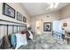 Comfortable main bedroom featuring vaulted ceiling, decorative wall art, and a black metal bed frame at 5738 Sabal Trace Dr # 204B57, North Port, FL 34287