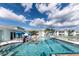 Outdoor pool in a community setting, with multiple lounge chairs and buildings in the background at 5738 Sabal Trace Dr # 204B57, North Port, FL 34287