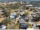 Aerial view of a house and surrounding neighborhood, showcasing a pool and large yard at 706 W Madison St, Plant City, FL 33563