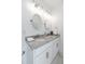 Double vanity bathroom with granite countertop and oval mirrors at 706 W Madison St, Plant City, FL 33563