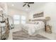 Spacious bedroom with large bed, neutral decor, and marble flooring at 706 W Madison St, Plant City, FL 33563