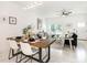Modern dining room features a wood table, white chairs, and stylish decor at 706 W Madison St, Plant City, FL 33563