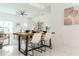 Modern dining room features a wood table, white chairs, and stylish decor at 706 W Madison St, Plant City, FL 33563