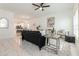 Bright living room with open floor plan, stylish furniture, and tile floors at 706 W Madison St, Plant City, FL 33563
