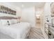 Main bedroom with king bed, ensuite bathroom access, and marble floors at 706 W Madison St, Plant City, FL 33563