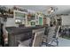Bar room featuring Green Bay Packers decor, a wet bar, a sliding door and a table with chairs at 9 Logan St, Port Charlotte, FL 33954