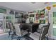Bar room featuring Green Bay Packers decor, a wet bar, a sliding door and a table with chairs at 9 Logan St, Port Charlotte, FL 33954