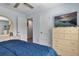 Relaxing primary bedroom with soft, neutral walls, a dresser with TV, and bright natural light at 9 Logan St, Port Charlotte, FL 33954