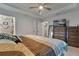 This primary bedroom has a tray ceiling and a large dresser with a television at 9 Logan St, Port Charlotte, FL 33954
