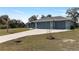 Charming single-story home featuring a three-car garage and well-maintained landscaping at 9 Logan St, Port Charlotte, FL 33954