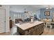 Open concept living room with island, recessed lighting, and access to living room and dining area at 9 Logan St, Port Charlotte, FL 33954