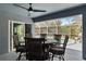 Covered patio featuring a table and chair set and a swimming pool at 9 Logan St, Port Charlotte, FL 33954