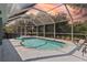 Relaxing screened-in pool area perfect for entertaining guests or Gathering fun at 9 Logan St, Port Charlotte, FL 33954