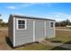 Durable outdoor storage shed with a ramp provides space for tools and equipment, enhancing organization and accessibility at 9 Logan St, Port Charlotte, FL 33954