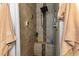 This updated bathroom has a tiled shower with a black shower head and built in bench at 9 Logan St, Port Charlotte, FL 33954