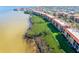 Breathtaking aerial perspective of waterfront condos with stunning views and natural shoreline at 91 Vivante Blvd # 402/9142, Punta Gorda, FL 33950