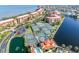 Beautiful aerial view of the Vivante community featuring tennis courts, pool, condos, and waterfront views at 91 Vivante Blvd # 402/9142, Punta Gorda, FL 33950