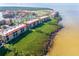 Stunning coastal view of the condo community, revealing its proximity to the water and vibrant surroundings at 91 Vivante Blvd # 402/9142, Punta Gorda, FL 33950