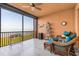 Balcony featuring chairs, tile floor and views of water at 91 Vivante Blvd # 402/9142, Punta Gorda, FL 33950