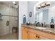 Bathroom featuring a granite countertop, and a glass-enclosed shower with a neutral tile surround at 91 Vivante Blvd # 402/9142, Punta Gorda, FL 33950
