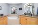 Bathroom with soaking tub, granite countertops, and natural light at 91 Vivante Blvd # 402/9142, Punta Gorda, FL 33950