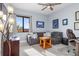 Cozy bedroom with a gray couch, stylish decor, and a ceiling fan at 91 Vivante Blvd # 402/9142, Punta Gorda, FL 33950